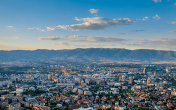 Top view from Vodno mountain on Skopje city in Macedonia on sunset (photo via RossHelen / iStock / Getty Images Plus)