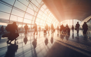 Crowd of travelers inside an airport terminal