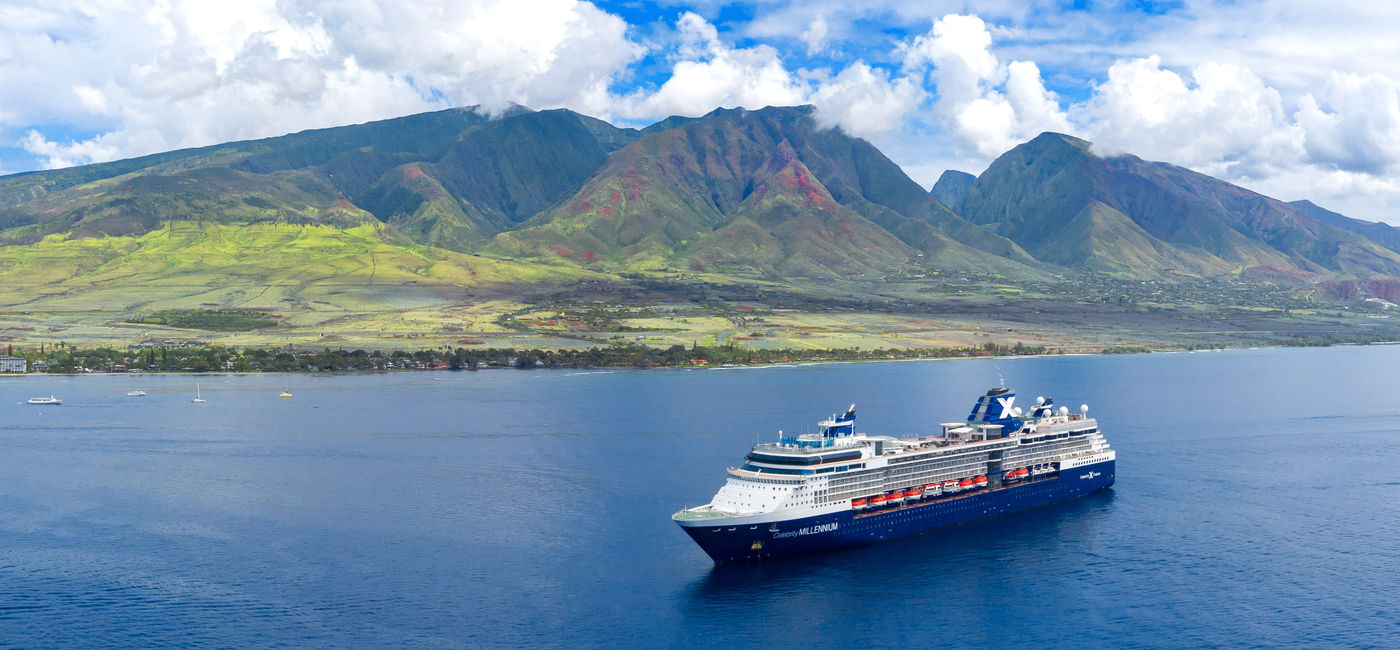 Image: Celebrity Millennium sailing near the mountains of Hawaii. (Photo Credit: Adobe Stock/jdross75)