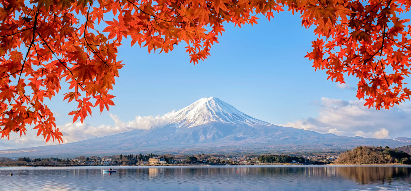 Image: Mount Fuji viewed from the lake in autumn. (Photo Credit: Phattana / Adobe Stock)
