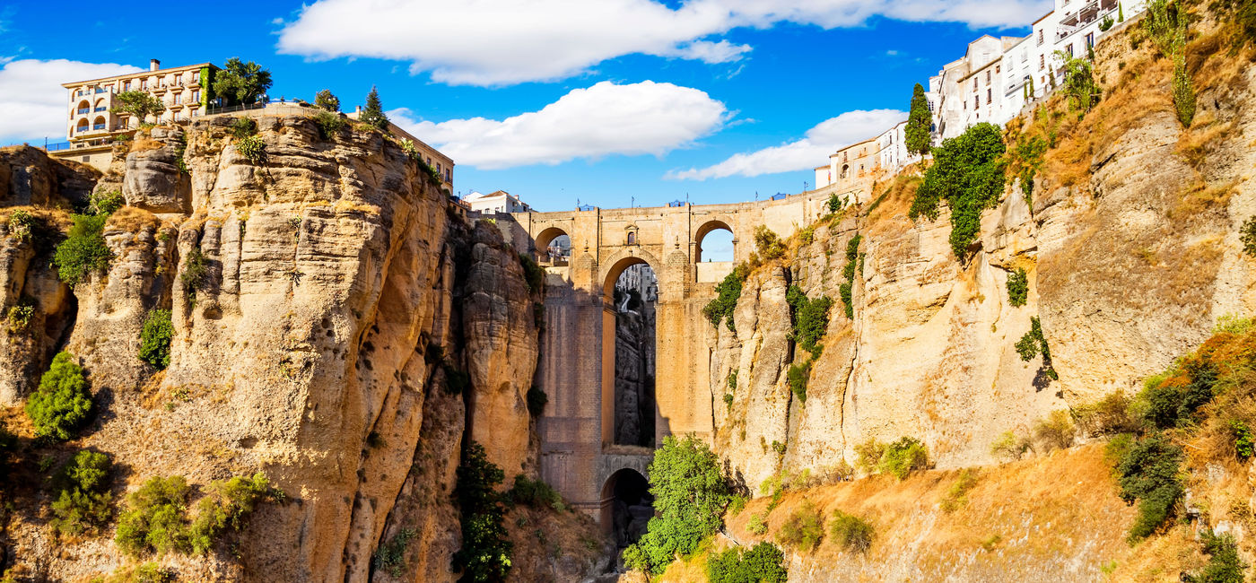 Image: Panoramic view of the old city of Ronda, one of the famous white villages in the province of Malaga, Andalusia, Spain (photo via MarquesPhotography / iStock / Getty Images Plus)