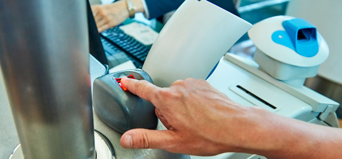 Image: Passenger using biometric technology at the airport. (Photo Credit: Adobe Stock/Georgy Dzyura)