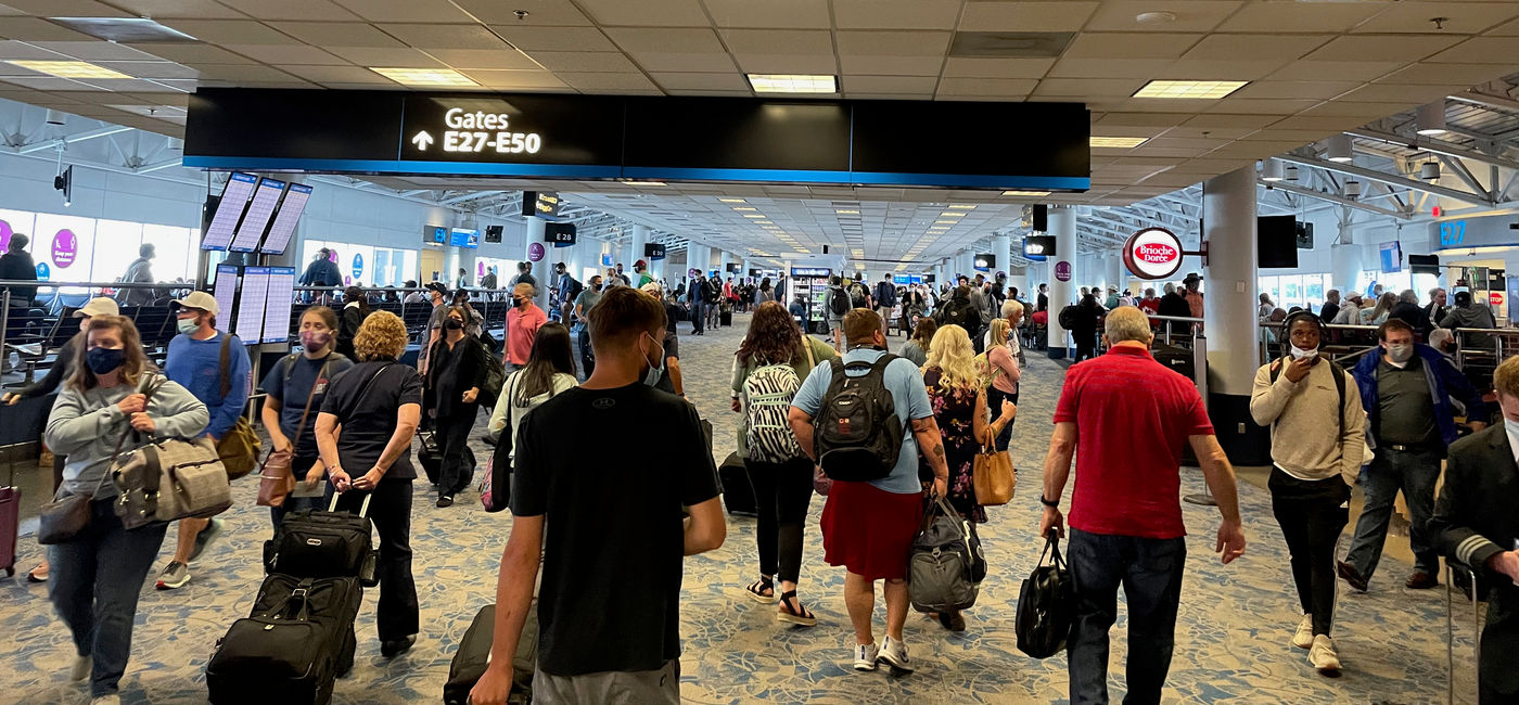 Image: Passengers moving through Charlotte Douglas International Airport. (Photo Credit: Patrick Clarke)