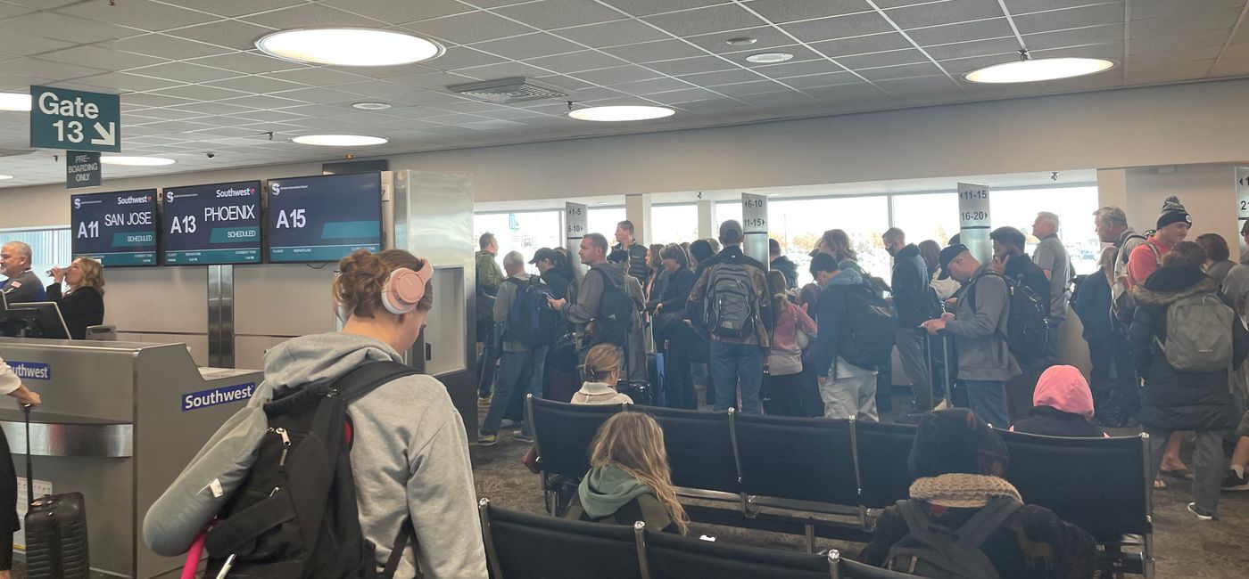 Image: Passengers waiting to board a Southwest flight at Spokane International Airport. (Photo Credit: Patrick Clarke)