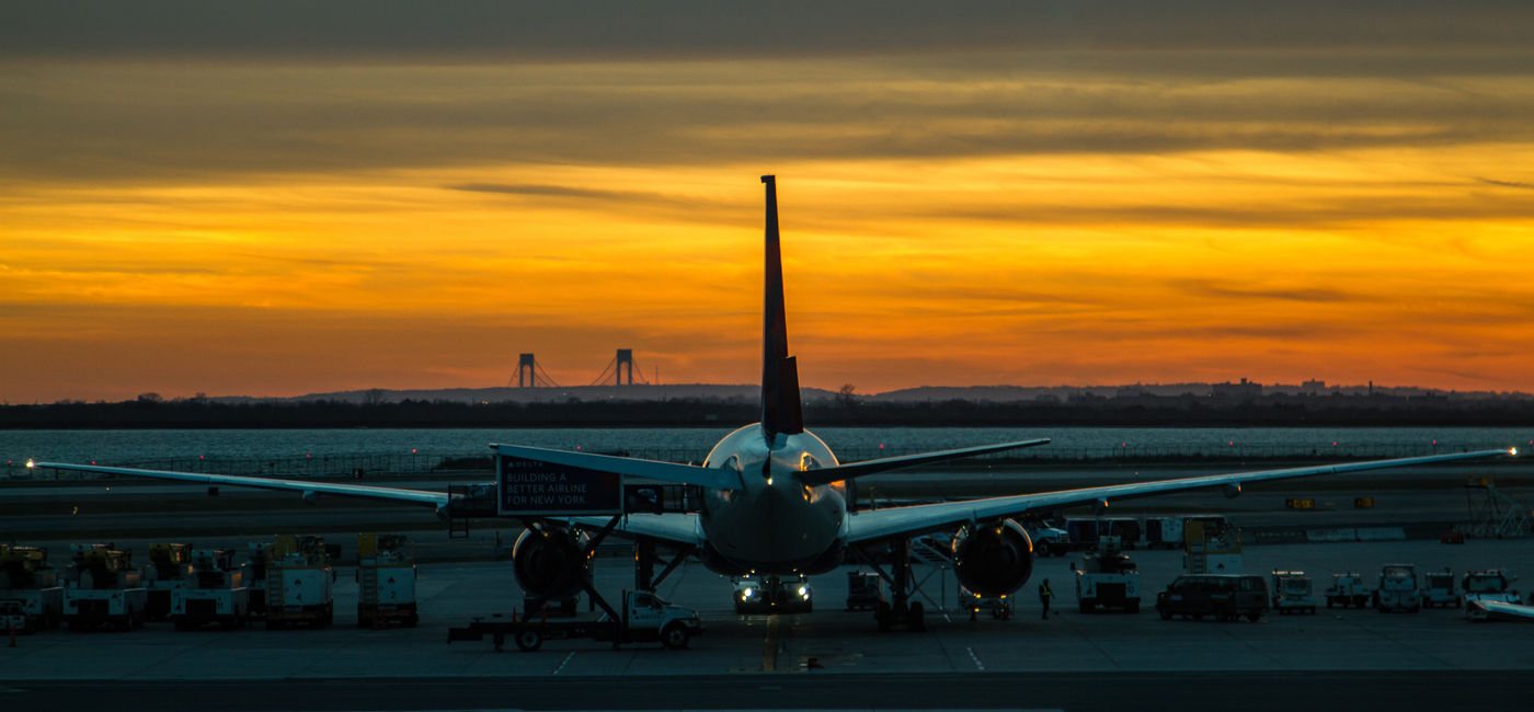 Image: Plane parked at JFK airport in New York. (Photo Credit: Beck / Adobe Stock)
