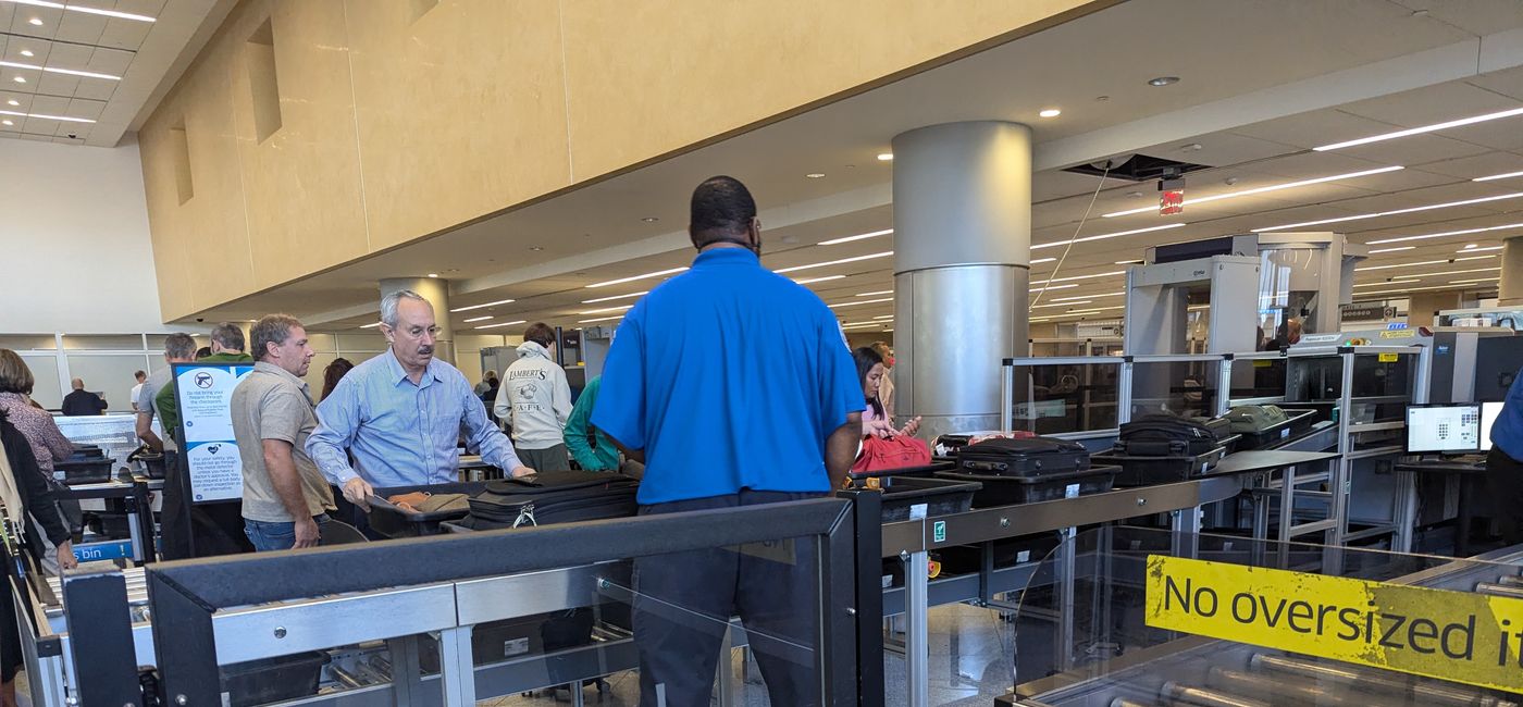 Image: Travelers go through TSA security (Photo Credit: Eric Bowman)