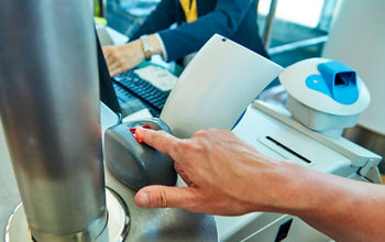 Passenger using biometric technology at the airport.