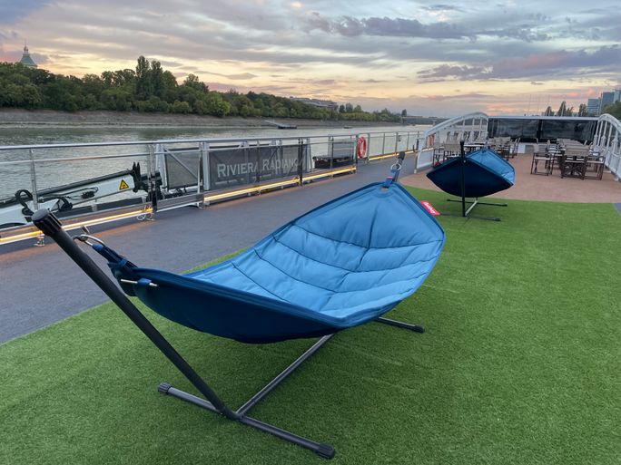 Travelers can relax and unwind in several large hammocks on the sun deck of Riviera Radiance Travelers can relax and unwind in several large hammocks on the sun deck of Riviera Radiance