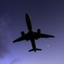 A plane flying at night, travel, redeye, flight,
